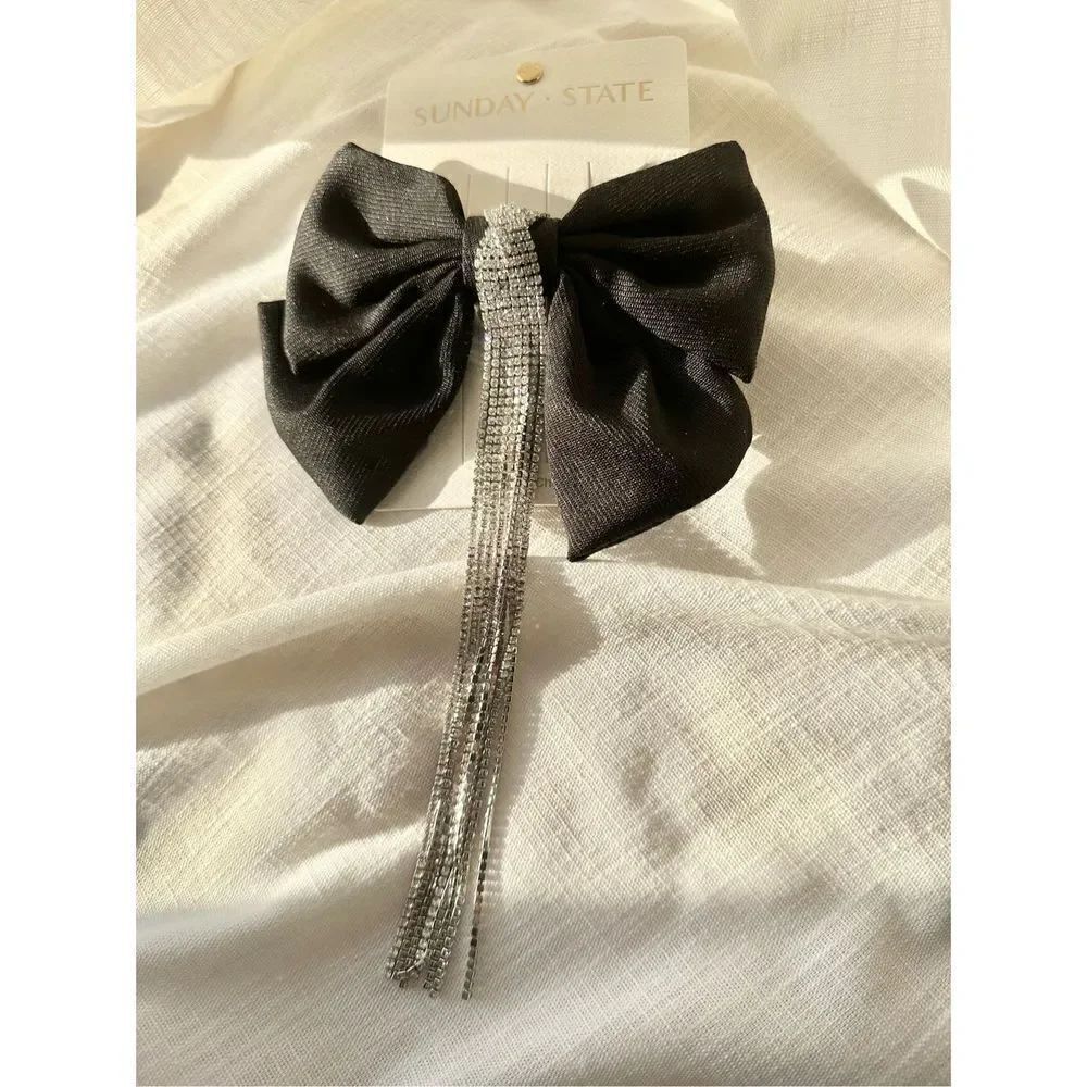 Black rhinestone embellished French club bow with dangling rhinestone tassel